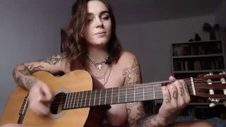 Busty emo girl plays Wicked Game on guitar