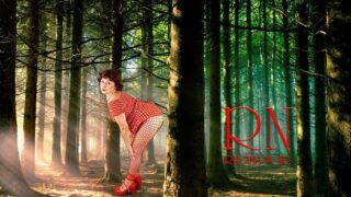 Pin-up lady posing in the forest. She shows her tits and pussy. Mesh tights. Special effect.